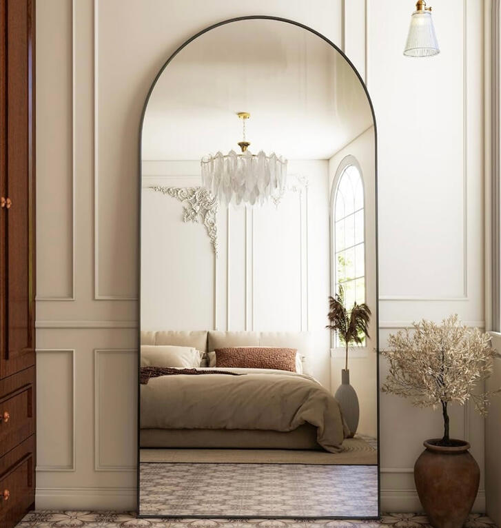 Elegant arched mirror in a wide frame, perfect for entryway or bedroom.